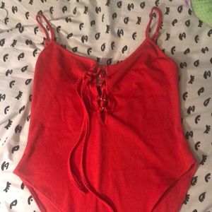 Red jumpsuit with adjustable straps.